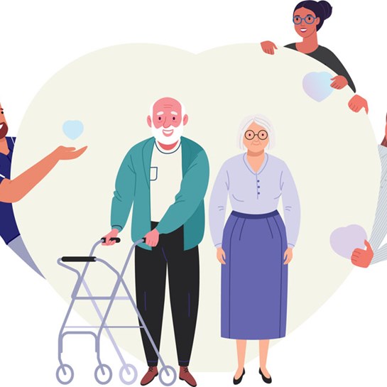 an older couple with st vincent's staff smiling around them